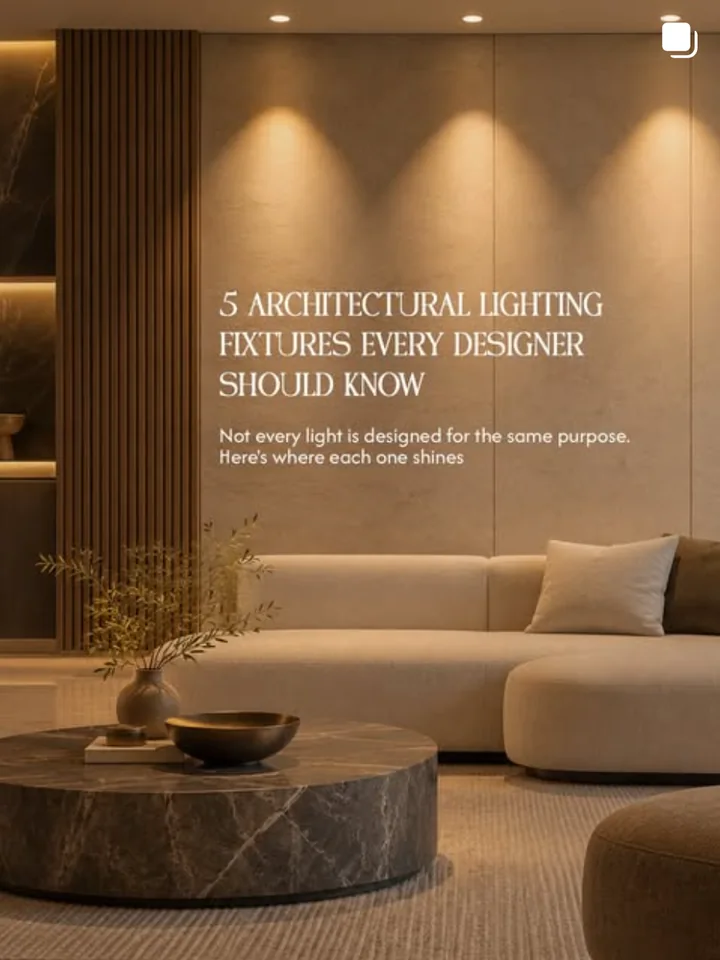 An Illuminatics Instagram post, 5 architectural lighting fixtures every designer should know, over a living room washed by warm downlights.
