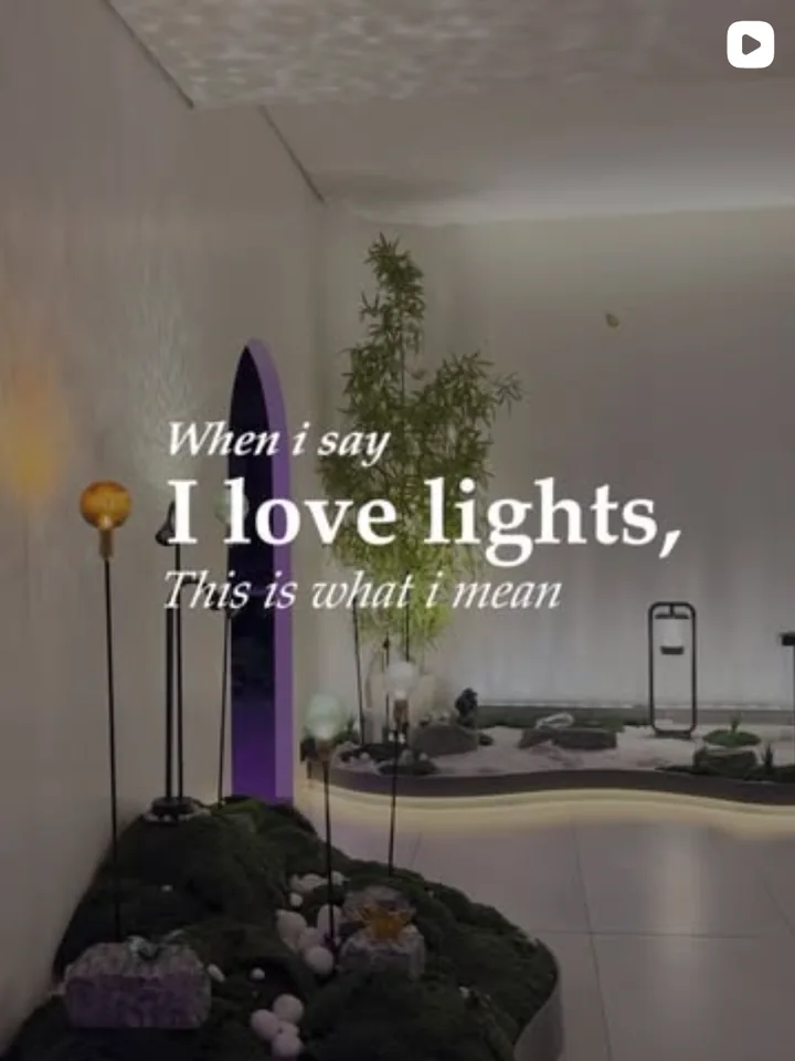 An Illuminatics Instagram reel cover, When I say I love lights, this is what I mean, over an indoor garden lit by a glowing strip.