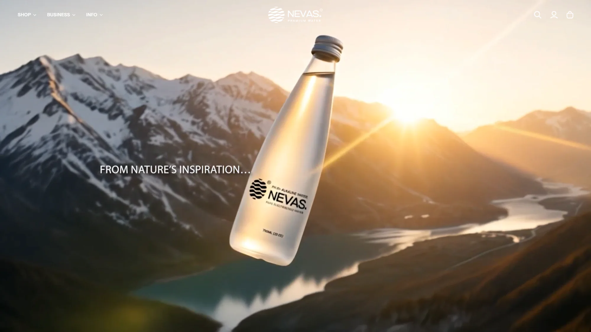 The nevas.in home page: a frosted NEVAS glass bottle over a sunlit mountain valley, with the line From nature’s inspiration.