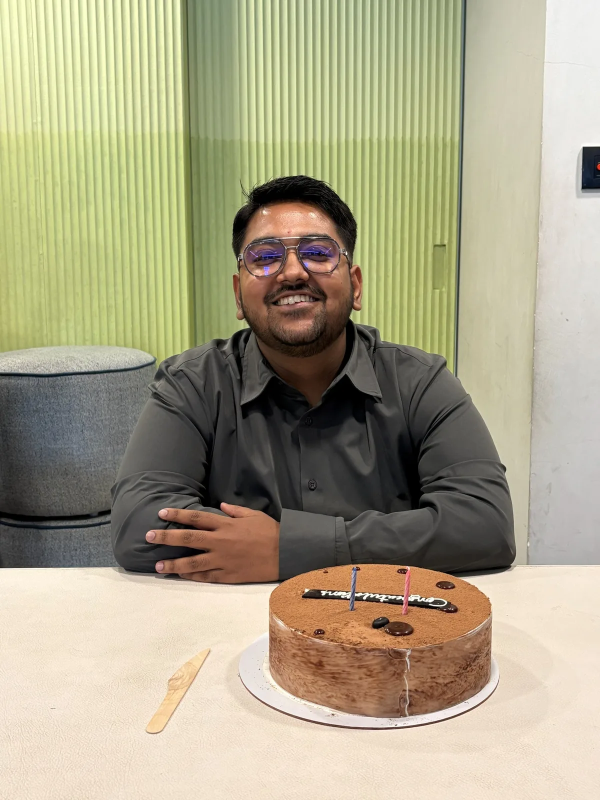 Shubham with his work anniversary cake