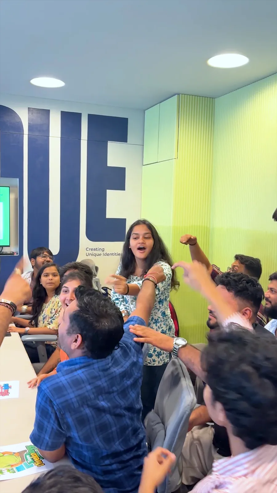 The team cheering during the office quiz